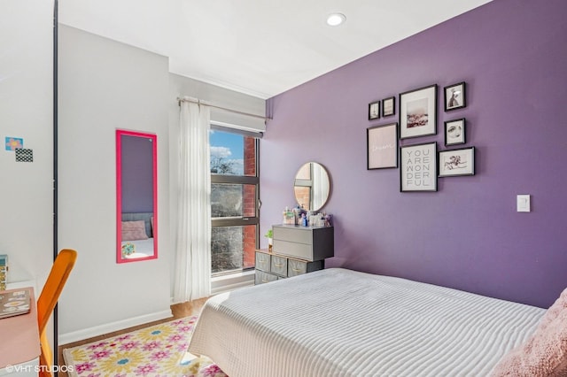 bedroom featuring baseboards