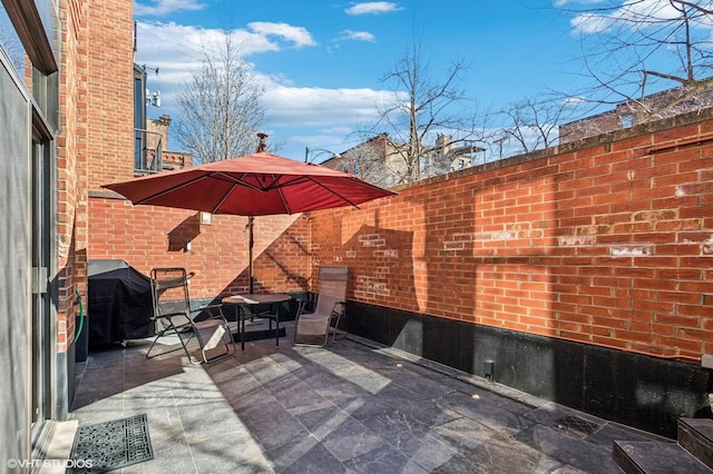 view of patio with a grill