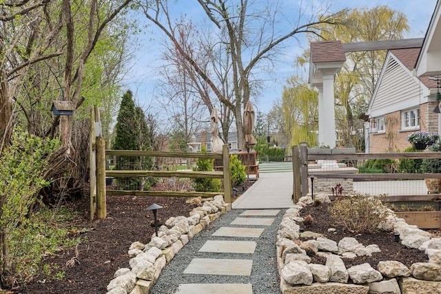 view of community with fence