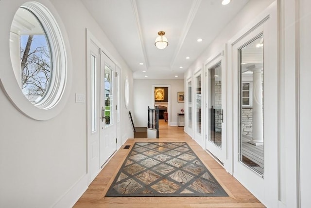 entryway featuring french doors, recessed lighting, light wood-style flooring, and baseboards