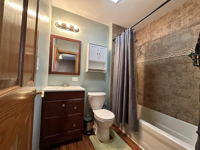 full bathroom with shower / bath combo, vanity, toilet, and wood finished floors