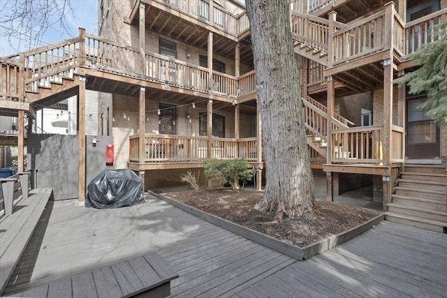 wooden deck featuring stairs