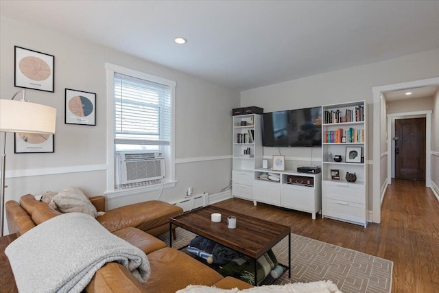 living area with cooling unit, dark wood-style flooring, recessed lighting, and a baseboard radiator