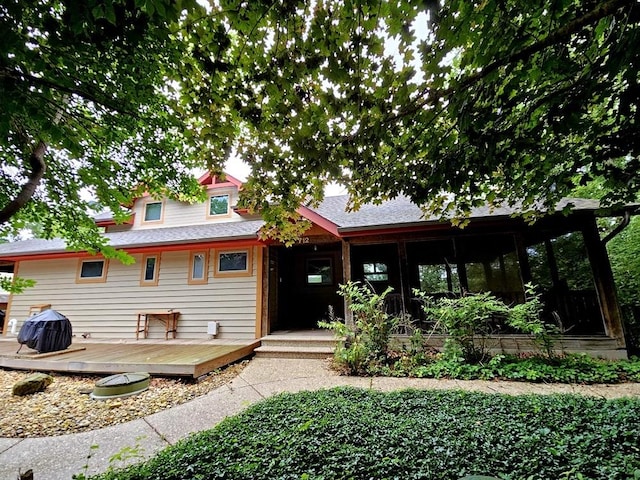 view of front of property with a sunroom