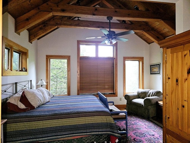 bedroom with a ceiling fan and vaulted ceiling with beams