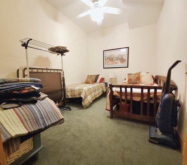 carpeted bedroom with ceiling fan and lofted ceiling