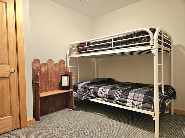 carpeted bedroom with baseboards