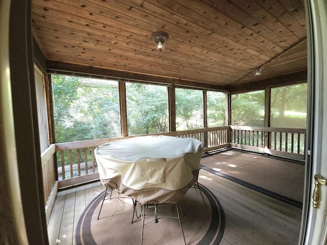 sunroom / solarium with lofted ceiling and wooden ceiling