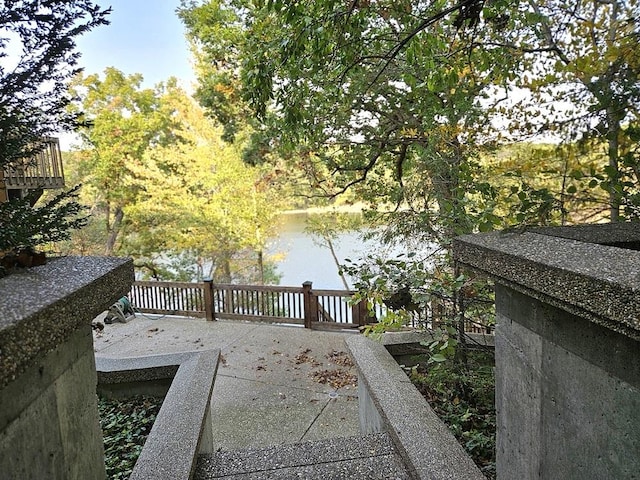 deck featuring a water view