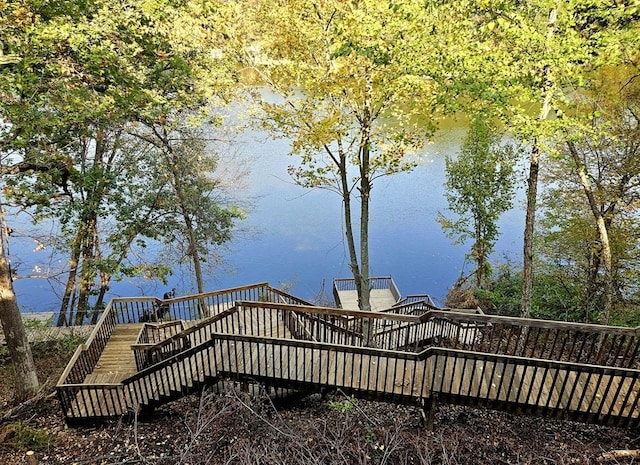 view of dock with a deck with water view