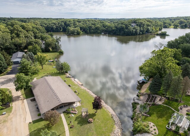 bird's eye view with a water view and a forest view