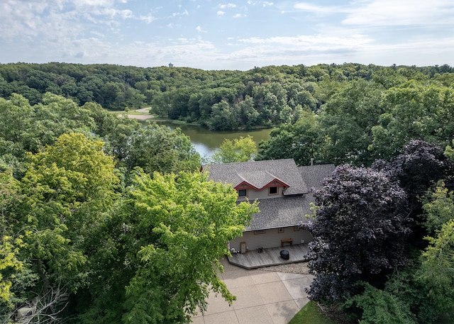 aerial view with a water view and a view of trees