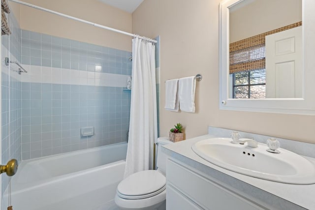 bathroom featuring shower / bath combo, vanity, and toilet