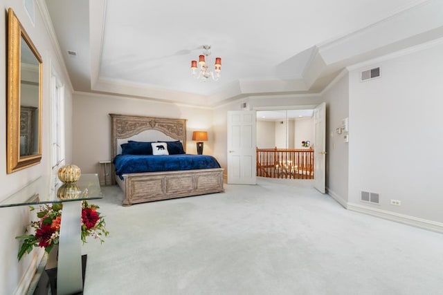 carpeted bedroom with a chandelier, baseboards, visible vents, and crown molding