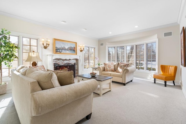 living area featuring recessed lighting, light colored carpet, a high end fireplace, visible vents, and ornamental molding