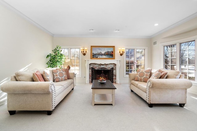 living area featuring a premium fireplace, crown molding, and light colored carpet