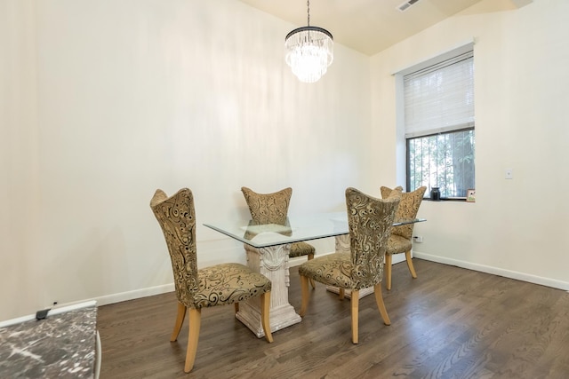 dining space with an inviting chandelier, wood finished floors, visible vents, and baseboards