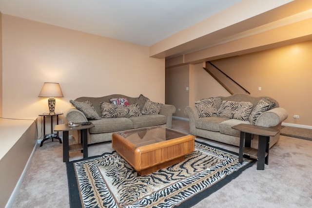 living room featuring carpet and baseboards