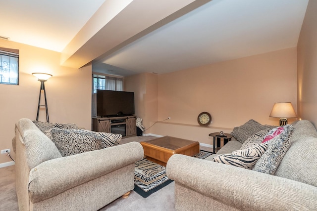 carpeted living room with visible vents and baseboards