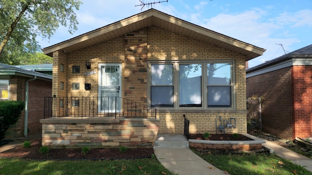 view of front of home with brick siding