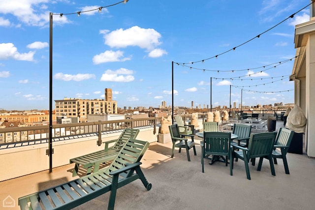 view of patio with a city view and a balcony