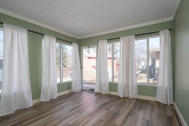 unfurnished sunroom with plenty of natural light