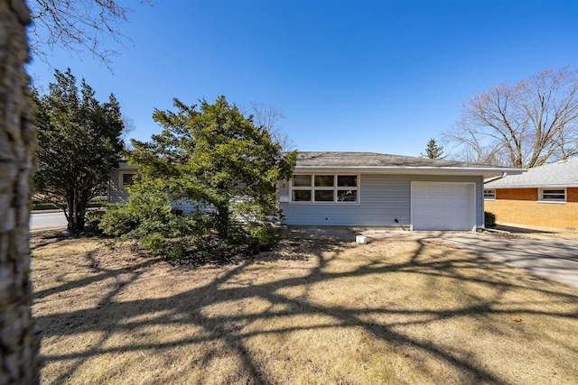 view of front of property featuring an attached garage and driveway