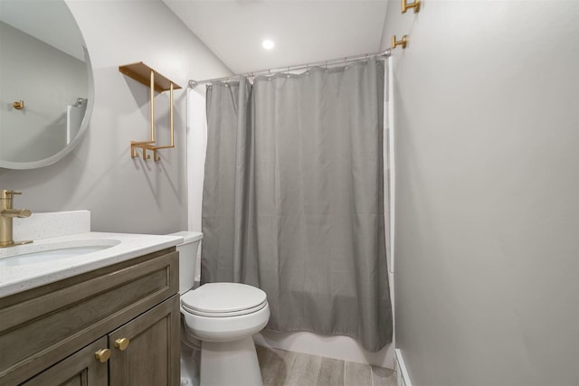 full bath featuring vanity, shower / bath combination with curtain, toilet, and wood finished floors