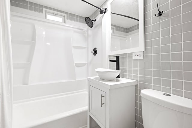 bathroom with toilet, vanity, shower / bath combo with shower curtain, and tile walls