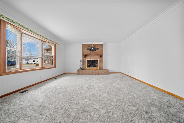 unfurnished living room featuring ornamental molding, carpet, a fireplace, and baseboards