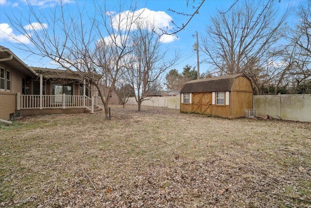 rear view of property with a yard, brick siding, and a sunroom