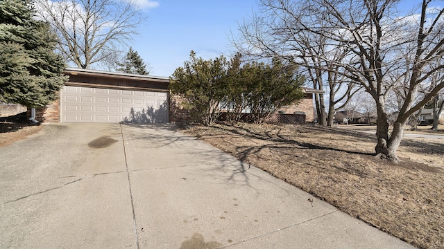 view of front of home featuring a garage and brick siding