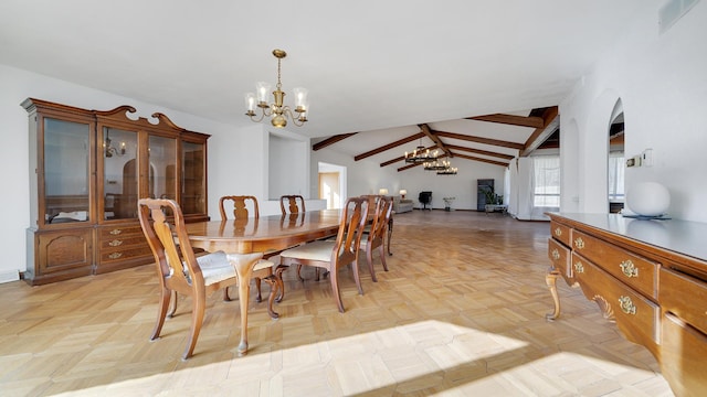 dining area with a notable chandelier and lofted ceiling with beams