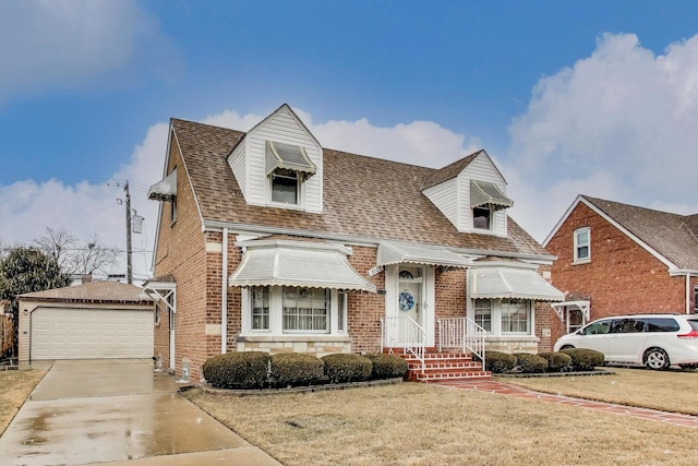 view of front of house with an outdoor structure, a garage, brick siding, and a front lawn