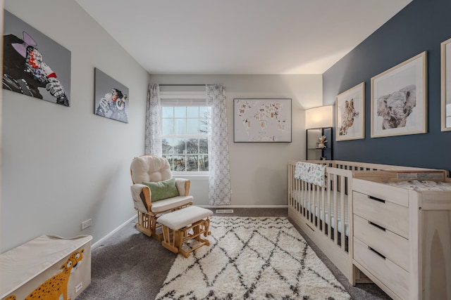 carpeted bedroom featuring baseboards