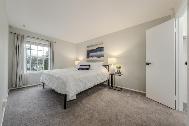 carpeted bedroom with baseboards