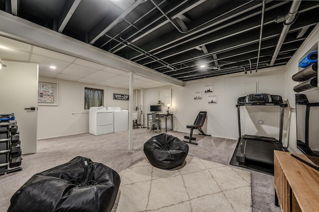 exercise room featuring carpet and washing machine and dryer