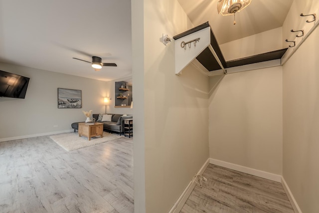 interior space featuring ceiling fan and wood finished floors