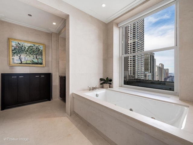 full bath with a tub with jets, crown molding, a city view, tile walls, and recessed lighting