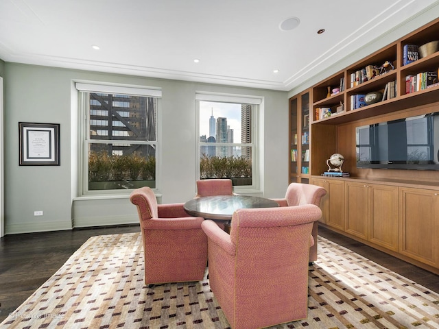 sitting room with built in features, recessed lighting, baseboards, and wood finished floors