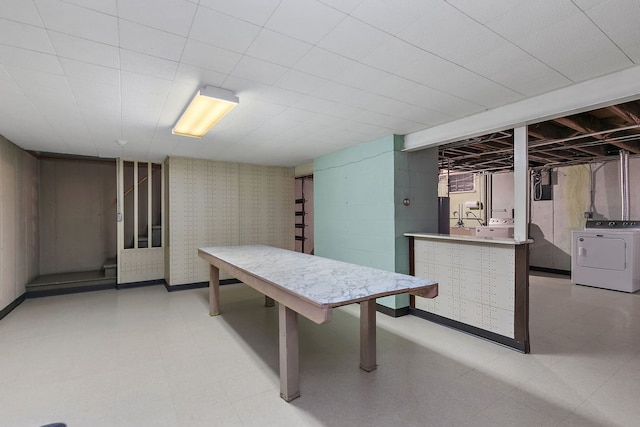 dining room featuring light floors and washer and clothes dryer