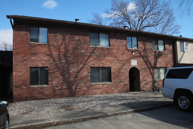 exterior space featuring brick siding