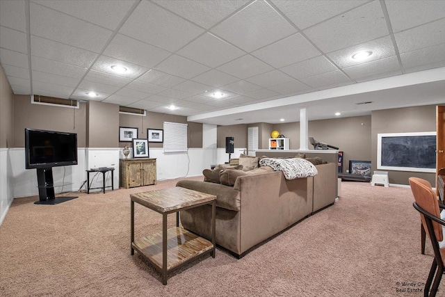 living area featuring baseboards, carpet floors, a paneled ceiling, and recessed lighting