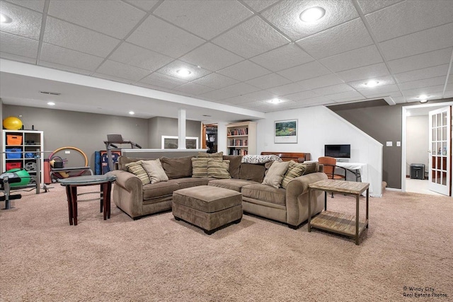 carpeted living area featuring recessed lighting and visible vents