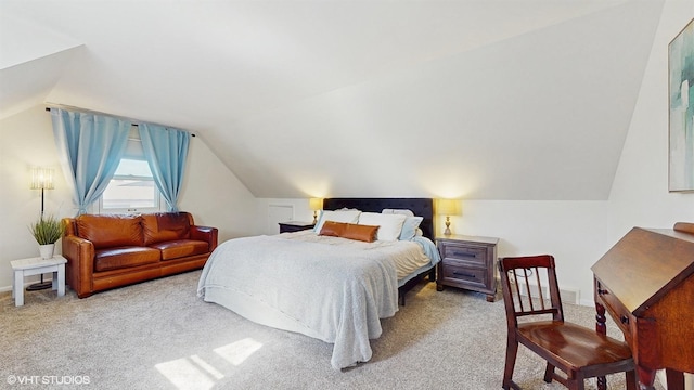 carpeted bedroom featuring lofted ceiling