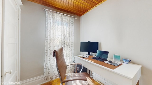 office space with baseboards, wooden ceiling, and ornamental molding