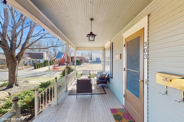 wooden terrace with a porch