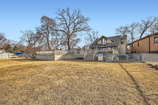 view of yard with a deck and fence