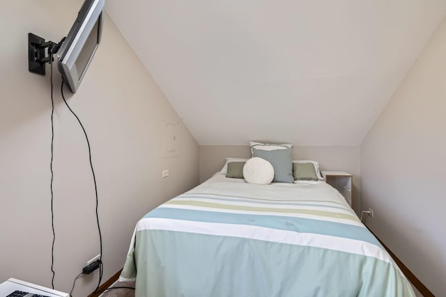 bedroom with lofted ceiling