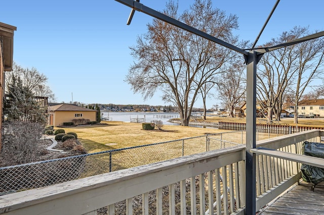 exterior space with fence private yard and a water view